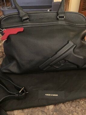 Authentic .. VLIEGER & VANDAM Black Leather Gun-Embossed Weekender Bag.